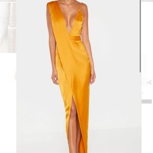 Mustard colored asymmetrical dress.